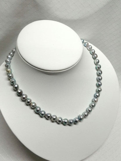Akoya pearl necklace with natural gray 7-7.9mm pearls and 42cm length displaying a shine