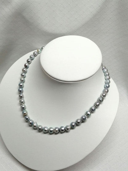 Akoya pearl necklace with natural gray 7-7.9mm pearls and 42cm length displaying a shine