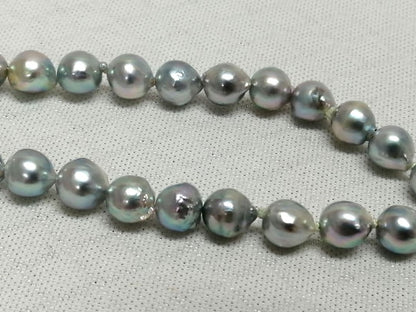 Akoya pearl necklace with natural gray 7-7.9mm pearls and 42cm length displaying a shine