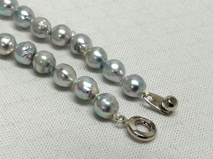 Akoya pearl necklace with natural gray 7-7.9mm pearls and 42cm length displaying a shine