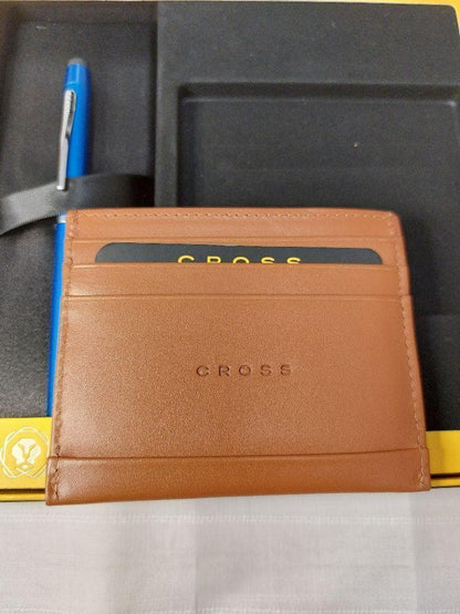 Cross ballpoint pen with blue brass resin body and chrome details alongside a brown leather card case