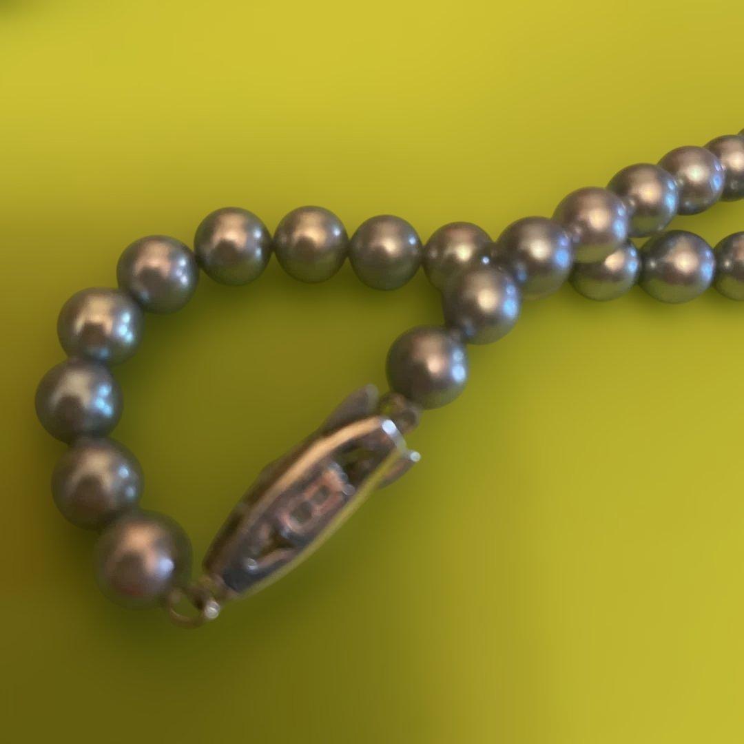 Tasaki silver pearl necklace with fish-shaped clasp, approximately 80 cm long