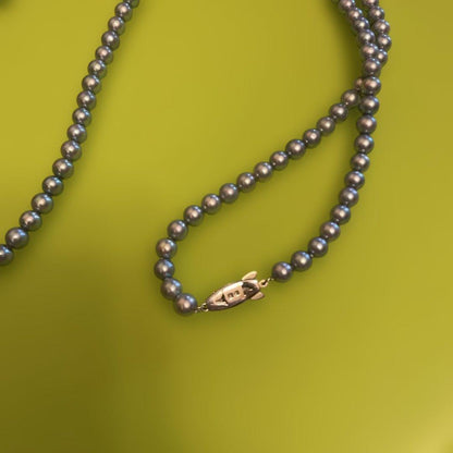 Tasaki silver pearl necklace with fish-shaped clasp, approximately 80 cm long