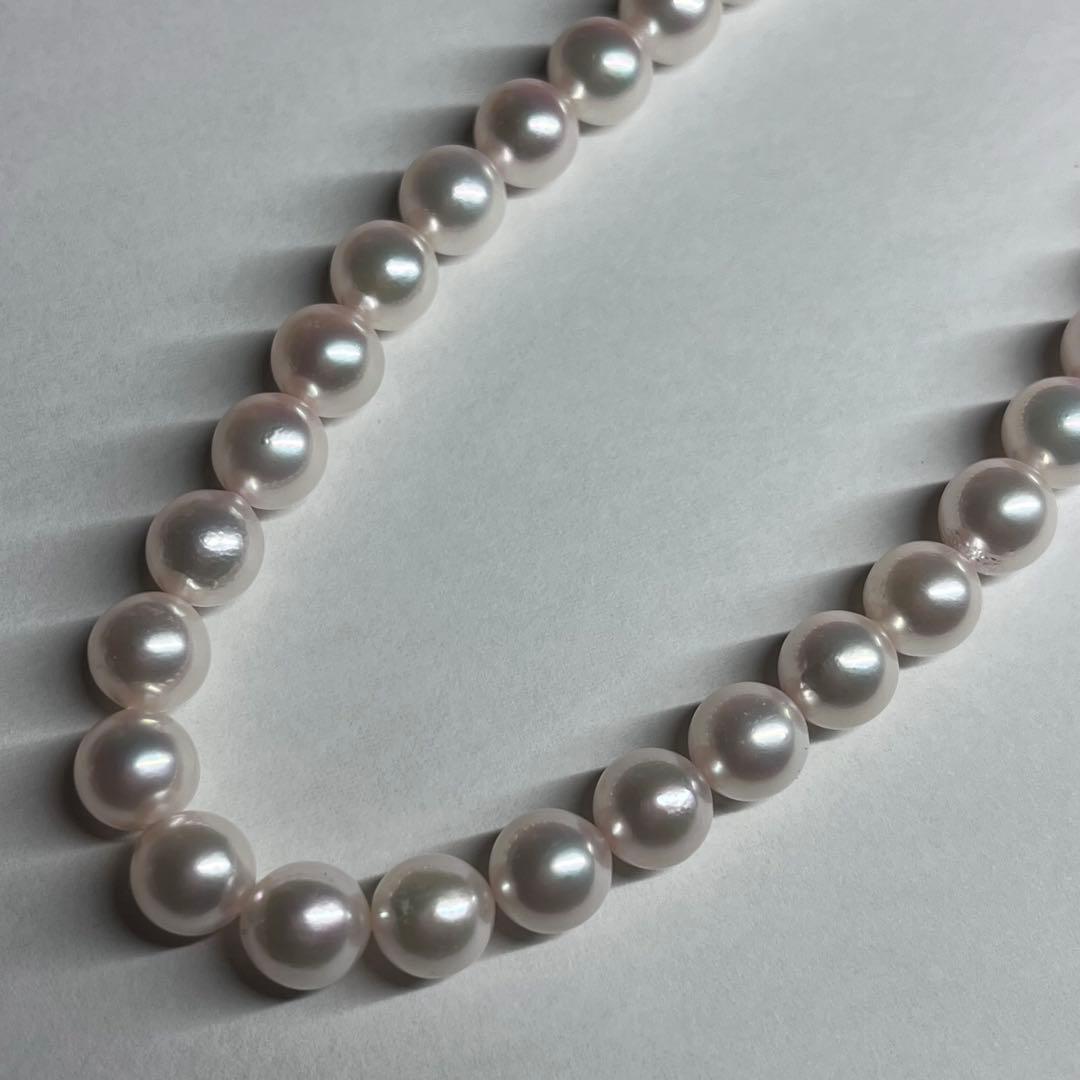 Akoya pearl necklace with 7.5-8.0mm pink white pearls and silver clasp on a white background