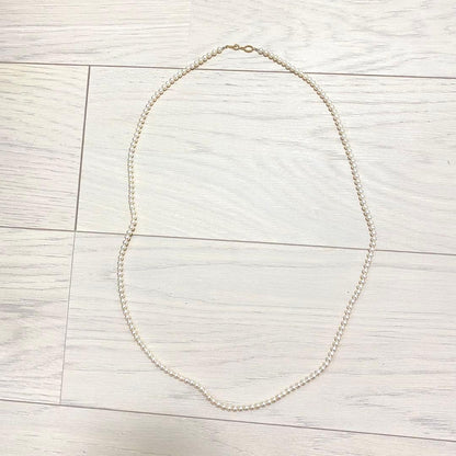 MIKIMOTO K18 gold long necklace with 5mm white pearls, 85cm length, displayed on a white background