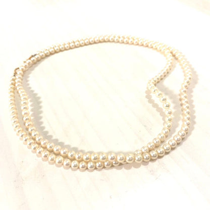 MIKIMOTO K18 gold long necklace with 5mm white pearls, 85cm length, displayed on a white background