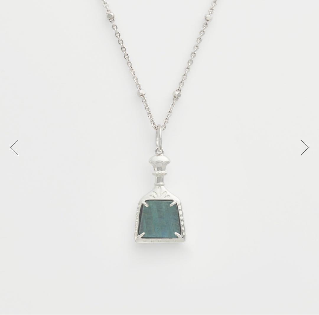 Agete necklace featuring labradorite and onyx stones with silver bottle-shaped pendant and charm