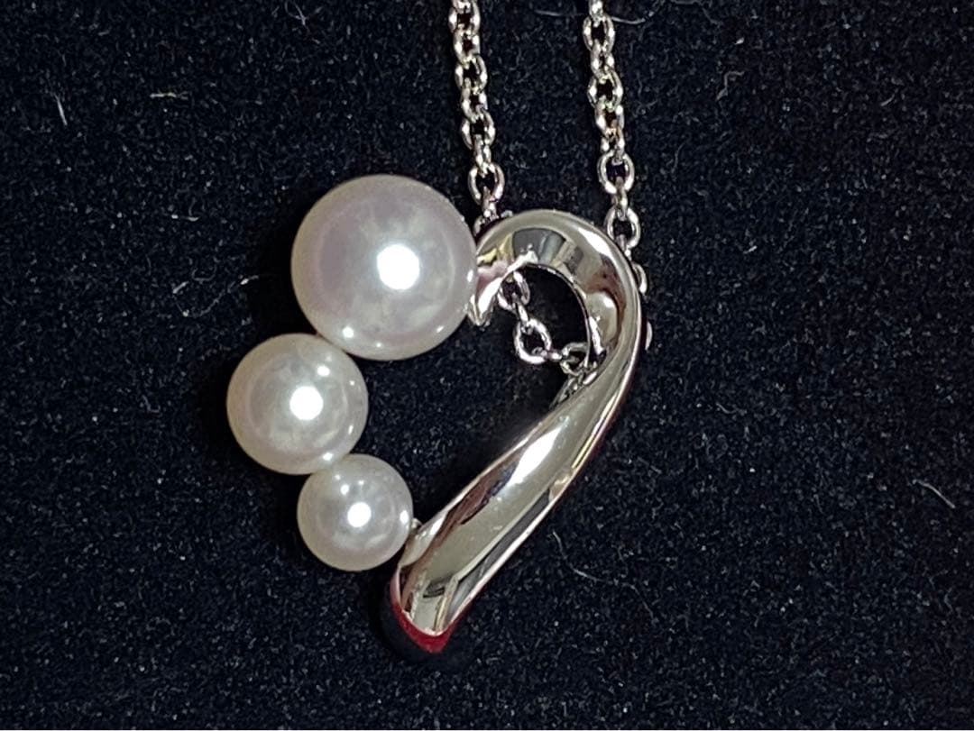 Tasaki pearl necklace made of silver SV925 with round white pearls displayed on a white background