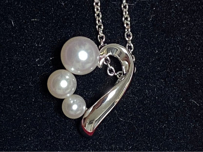 Tasaki pearl necklace made of silver SV925 with round white pearls displayed on a white background