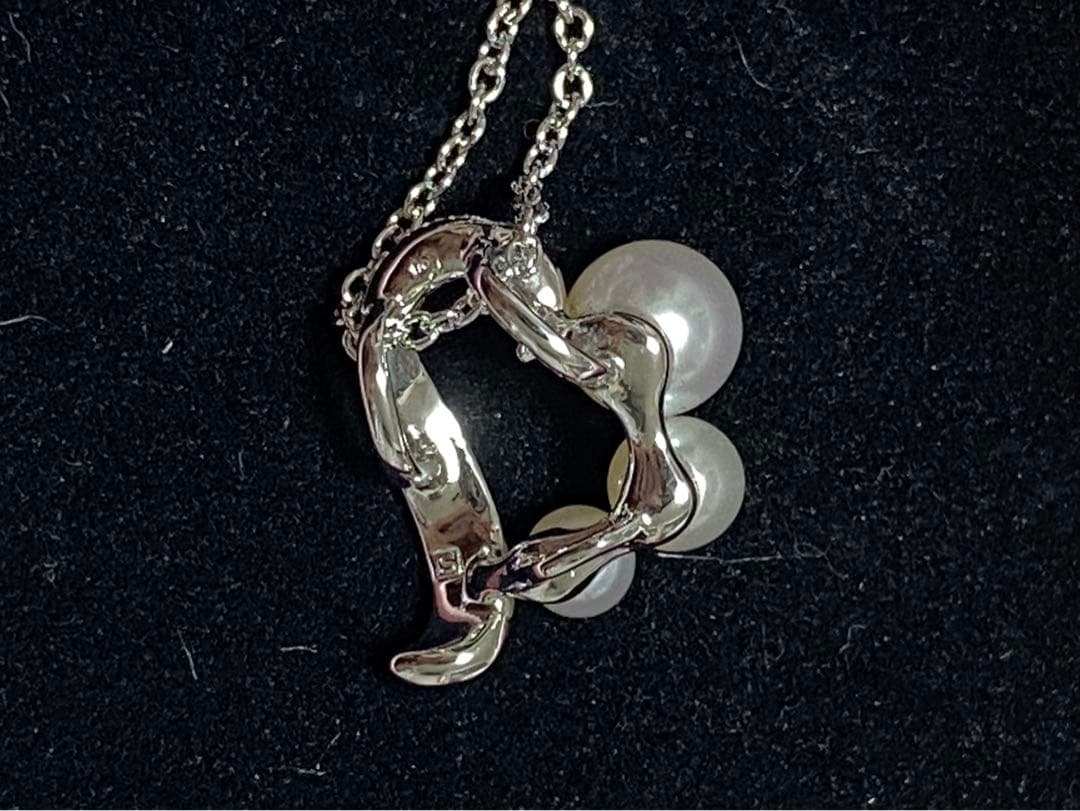 Tasaki pearl necklace made of silver SV925 with round white pearls displayed on a white background