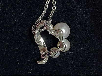 Tasaki pearl necklace made of silver SV925 with round white pearls displayed on a white background