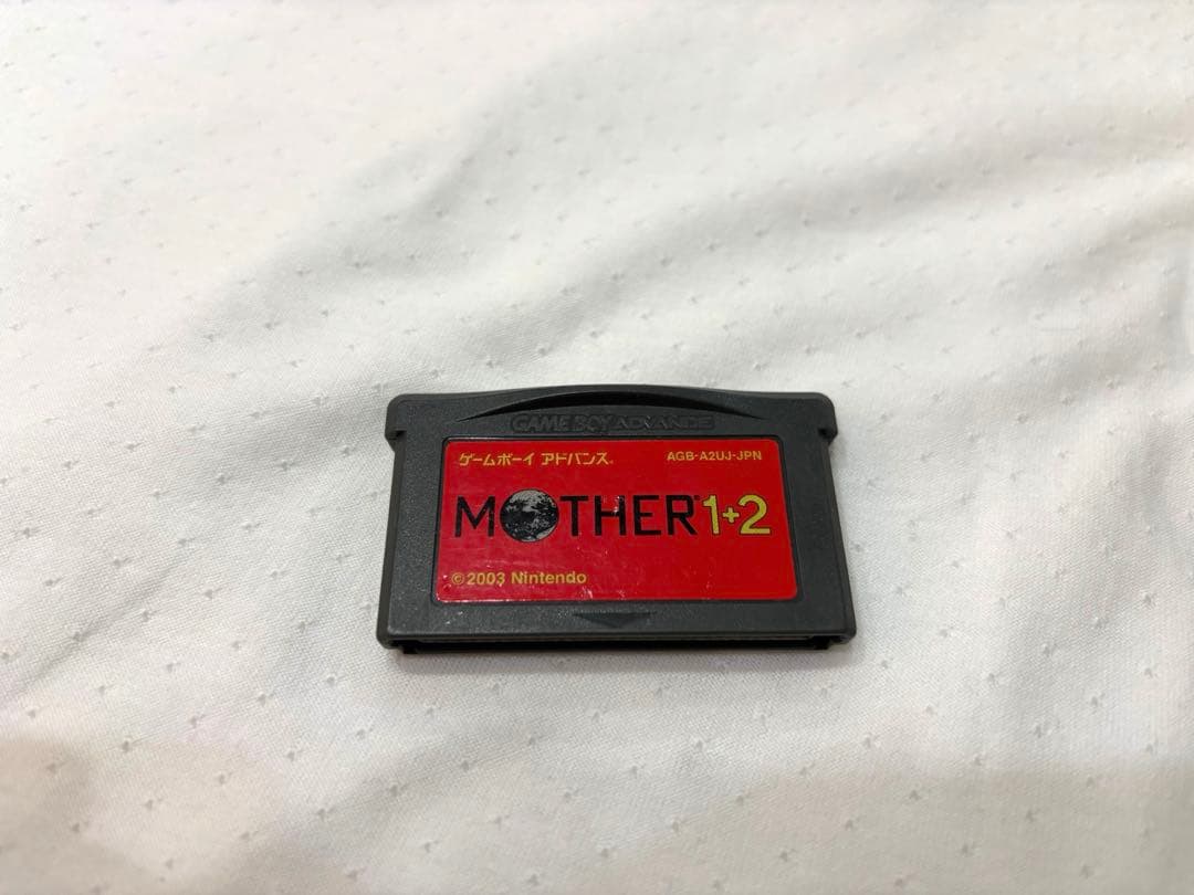 Mother 1+2 game cartridge for Game Boy Advance with original box showing wear and tears