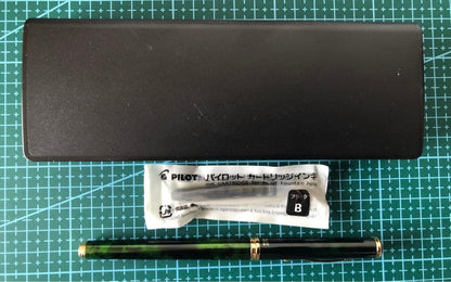 New Pilot Fountain Pen with pen cap, body, and enclosed accessories displayed on white background