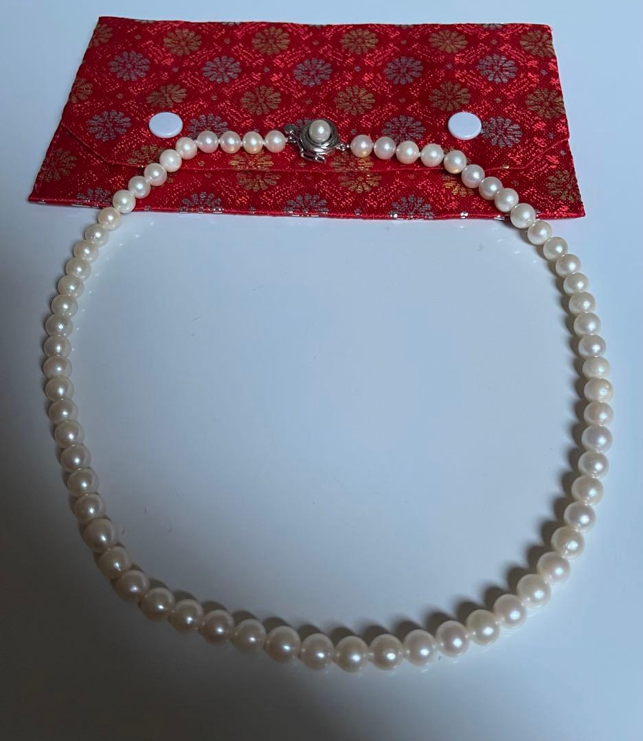 Akoya pearl necklace featuring a 6mm white pearl on a 43cm silver chain with a double lock princess clasp