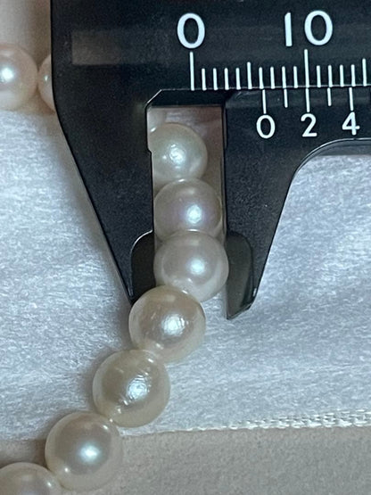Akoya pearl necklace featuring a 6mm white pearl on a 43cm silver chain with a double lock princess clasp