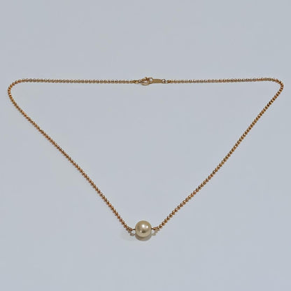 Mikimoto pearl necklace with 6.9mm pearl set in 18K yellow gold pendant on 40cm chain