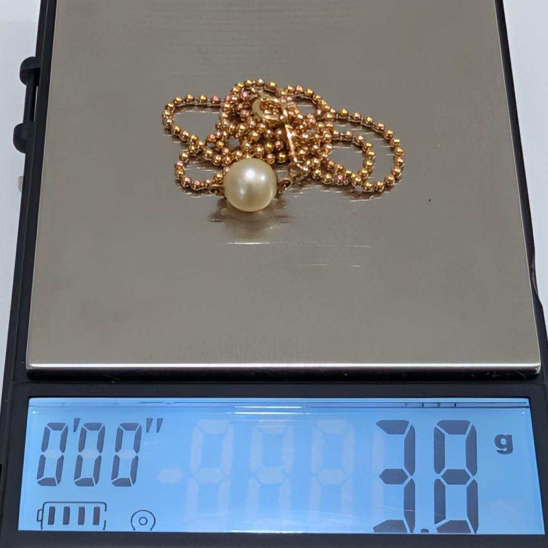 Mikimoto pearl necklace with 6.9mm pearl set in 18K yellow gold pendant on 40cm chain