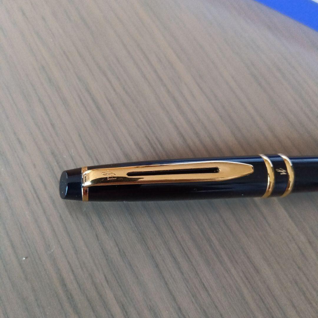 Waterman black ballpoint pen with gold metal fittings and plastic body displayed with dedicated case
