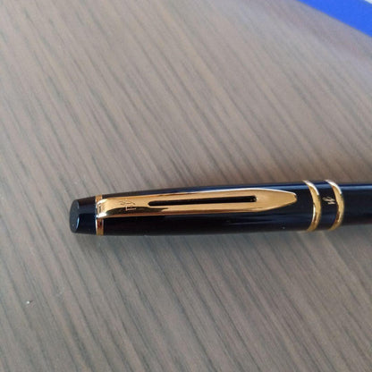 Waterman black ballpoint pen with gold metal fittings and plastic body displayed with dedicated case
