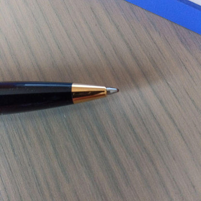 Waterman black ballpoint pen with gold metal fittings and plastic body displayed with dedicated case