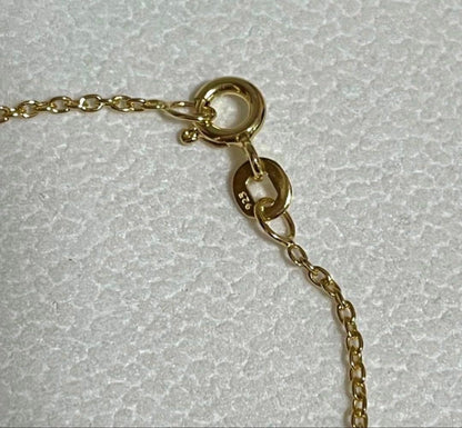 Akoya pearl station necklace with 9 white pink pearls and matching silver hook earrings set on white background