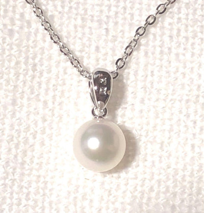 Mikimoto silver necklace featuring a single large 7.3mm pearl on a 40cm chain