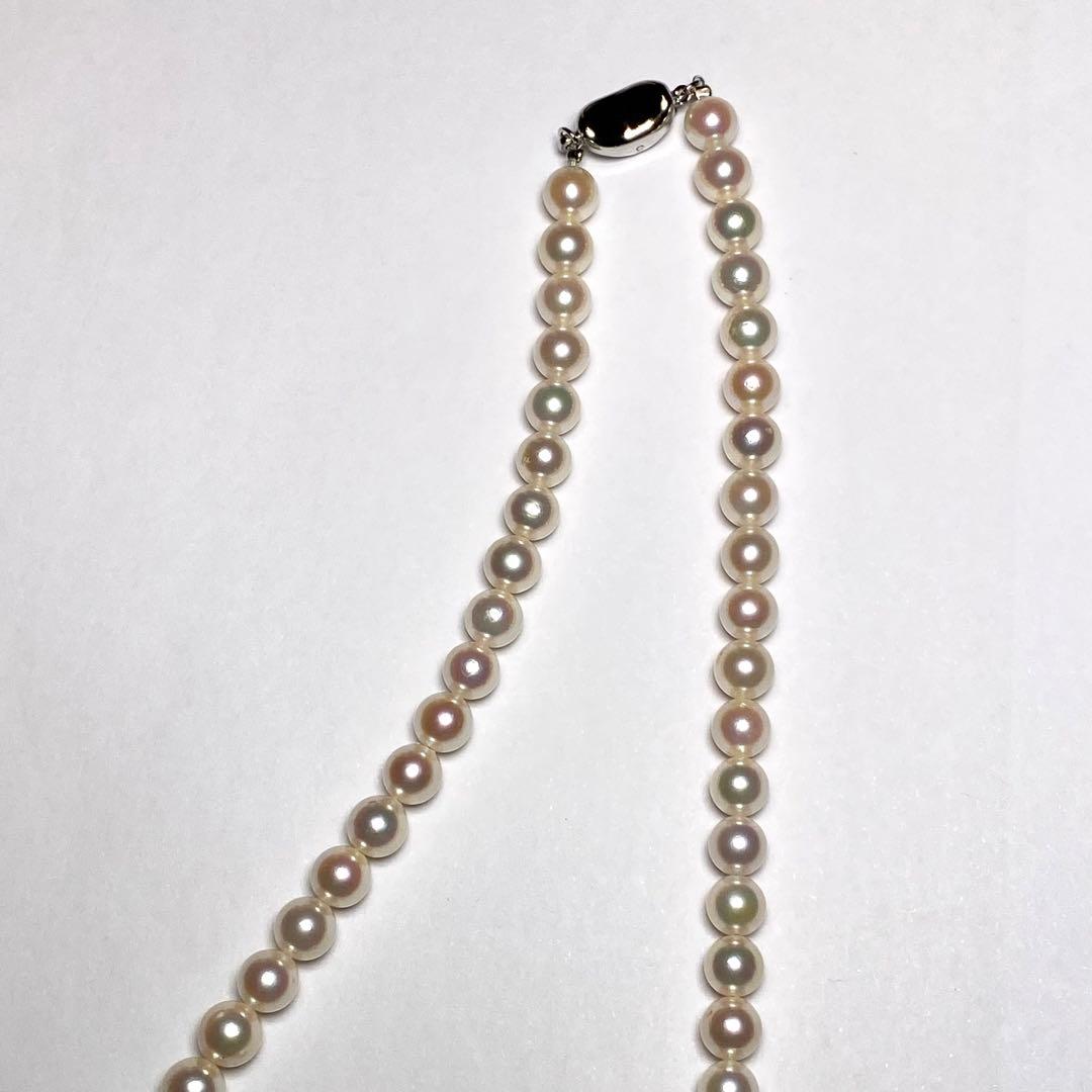 K906 Akoya pearl necklace with 6.5-7.0 mm pearls, 42 cm length, draped against a white background