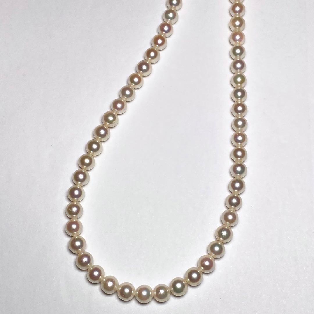 K906 Akoya pearl necklace with 6.5-7.0 mm pearls, 42 cm length, draped against a white background