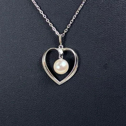 Mikimoto Heart Pearl Necklace featuring a silver engraved heart pendant and a 7mm genuine pearl on a 40cm chain