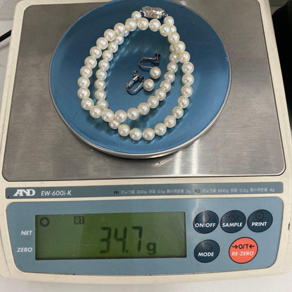 Akoya pearl necklace and matching earrings with 7mm white pearls on a 41cm chain