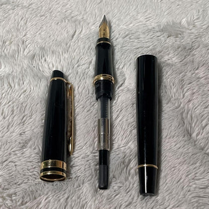 Close-up of a Waterman Fountain Pen with a sleek black body and silver accents