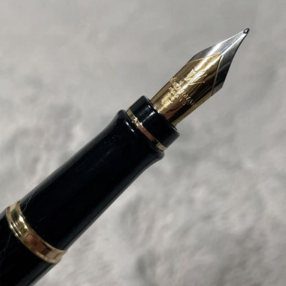 Close-up of a Waterman Fountain Pen with a sleek black body and silver accents