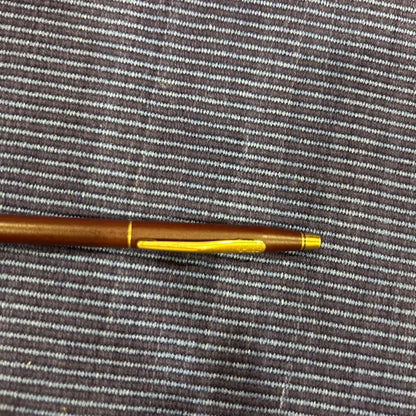 Cross ballpoint pen in wine red with gold accents showing scratches as per condition