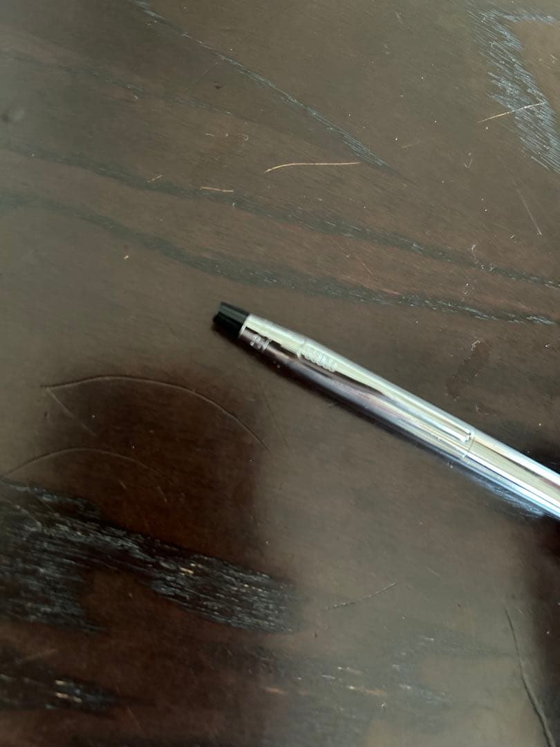 Cross ballpoint pen with twist mechanism shown uncapped on white background