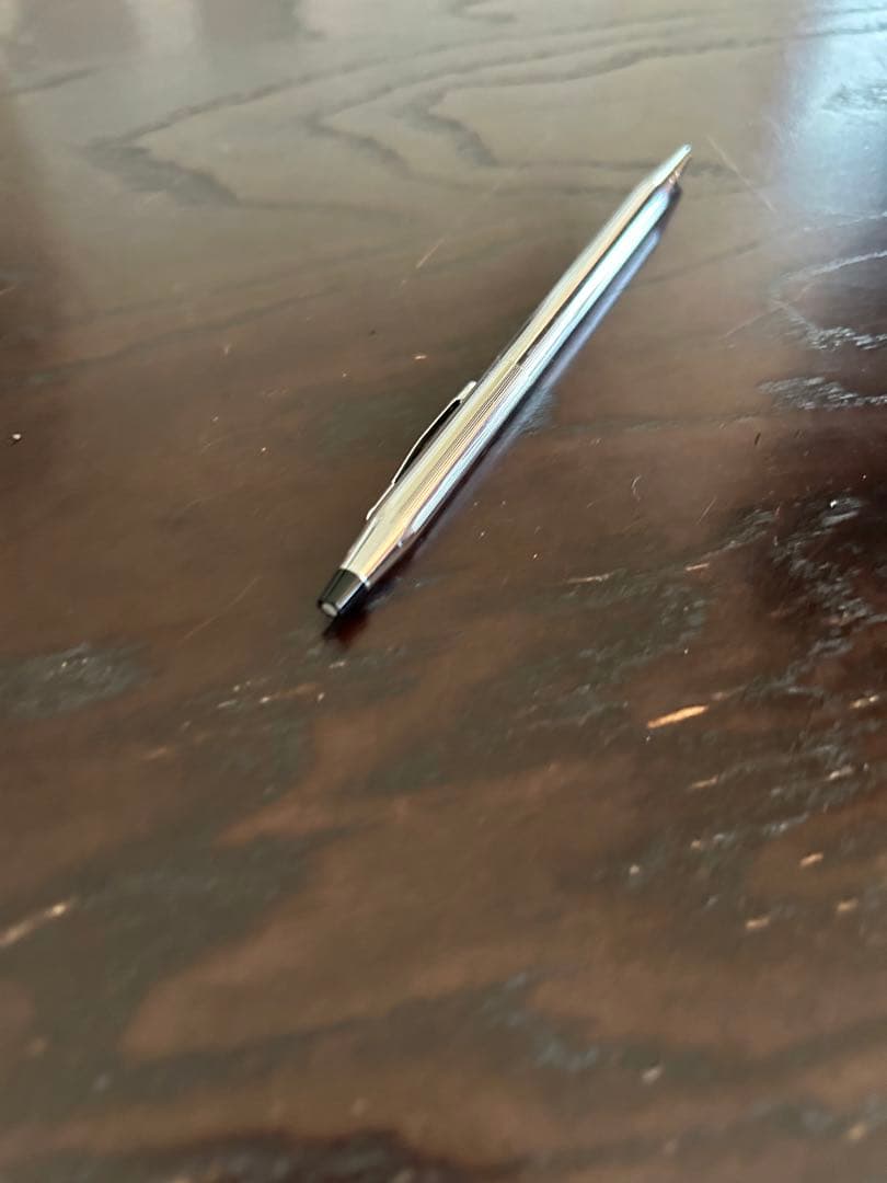 Cross ballpoint pen with twist mechanism shown uncapped on white background