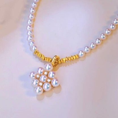 Law Akoya pearl pendant with square baby pearl and Vichy detail in 18K yellow gold, approximately 13mm size