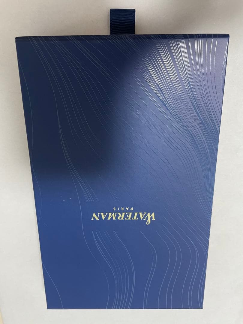 Waterman ballpoint pen in black with silver clip showing minor scratches on the body