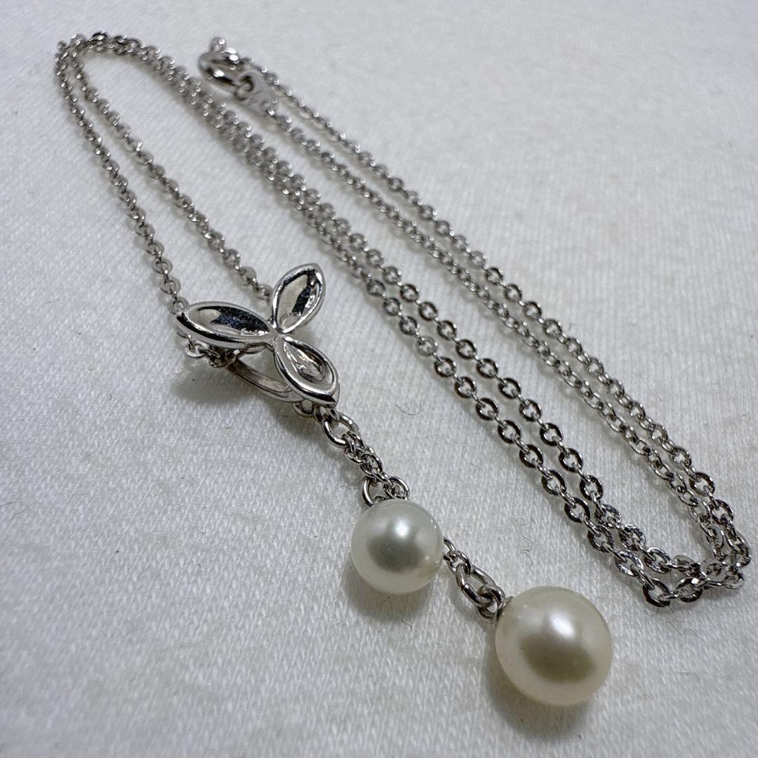 Tasaki silver necklace featuring two moving Akoya pearls on a 40 cm metal chain