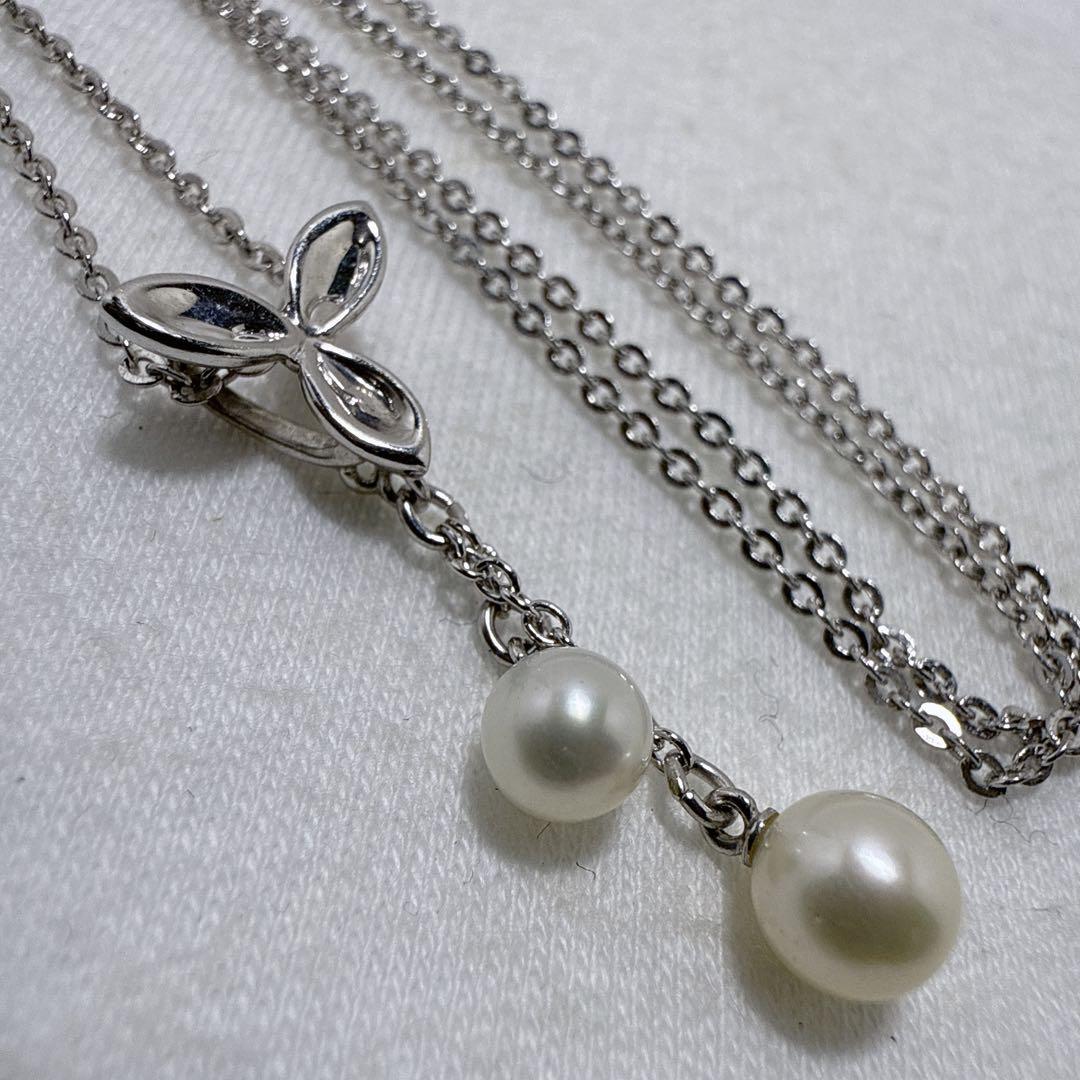 Tasaki silver necklace featuring two moving Akoya pearls on a 40 cm metal chain