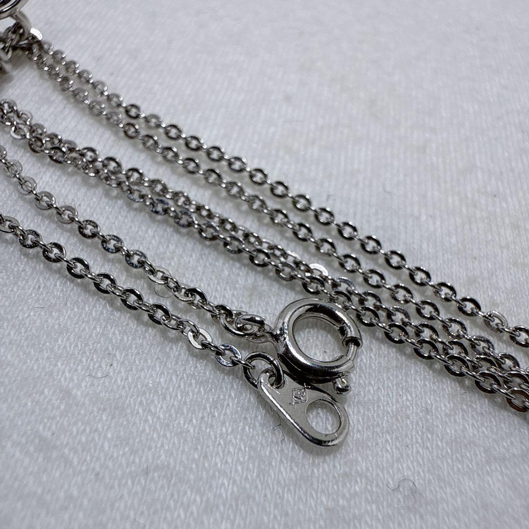 Tasaki silver necklace featuring two moving Akoya pearls on a 40 cm metal chain
