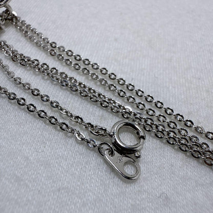 Tasaki silver necklace featuring two moving Akoya pearls on a 40 cm metal chain