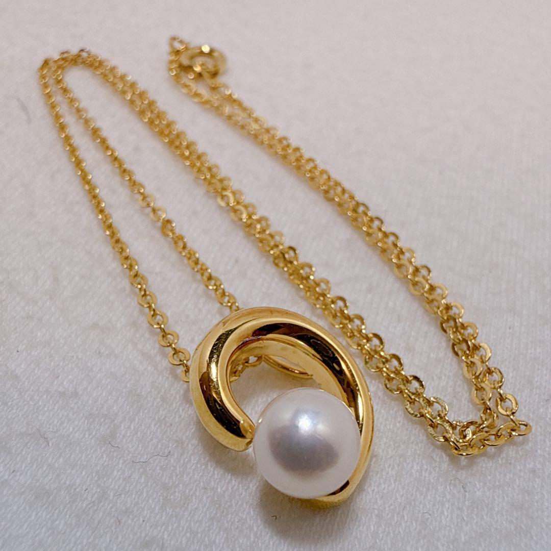 Tasaki necklace with gold color, single pearl pendant on silver and metal circular chain