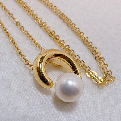 Tasaki necklace with gold color, single pearl pendant on silver and metal circular chain