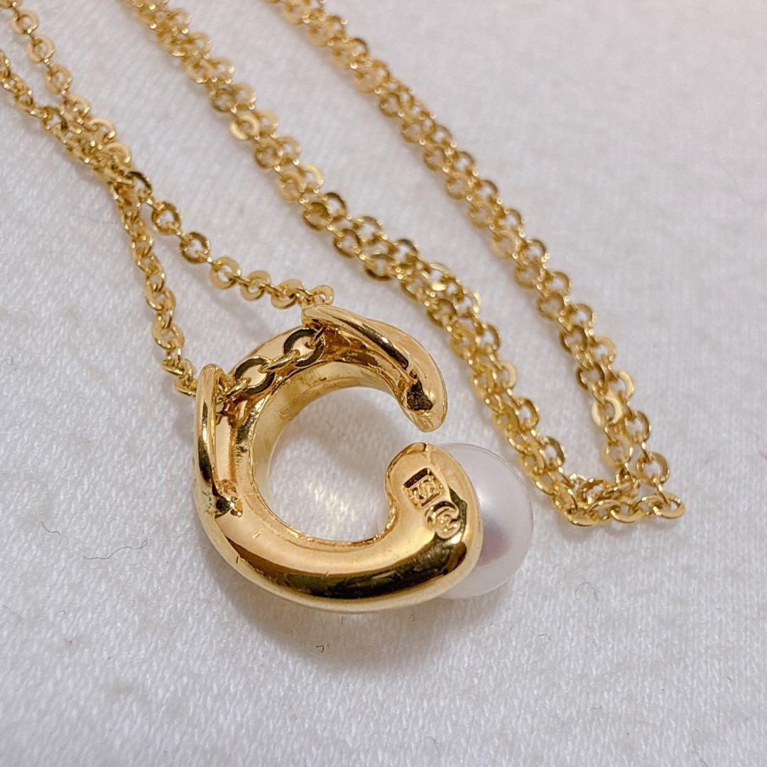 Tasaki necklace with gold color, single pearl pendant on silver and metal circular chain