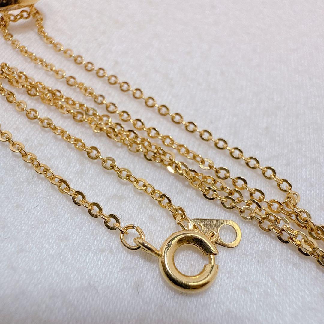 Tasaki necklace with gold color, single pearl pendant on silver and metal circular chain
