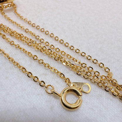 Tasaki necklace with gold color, single pearl pendant on silver and metal circular chain