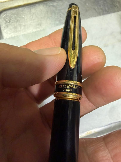 Waterman Paris black gold fountain pen with sleek design and gold accents on a white background