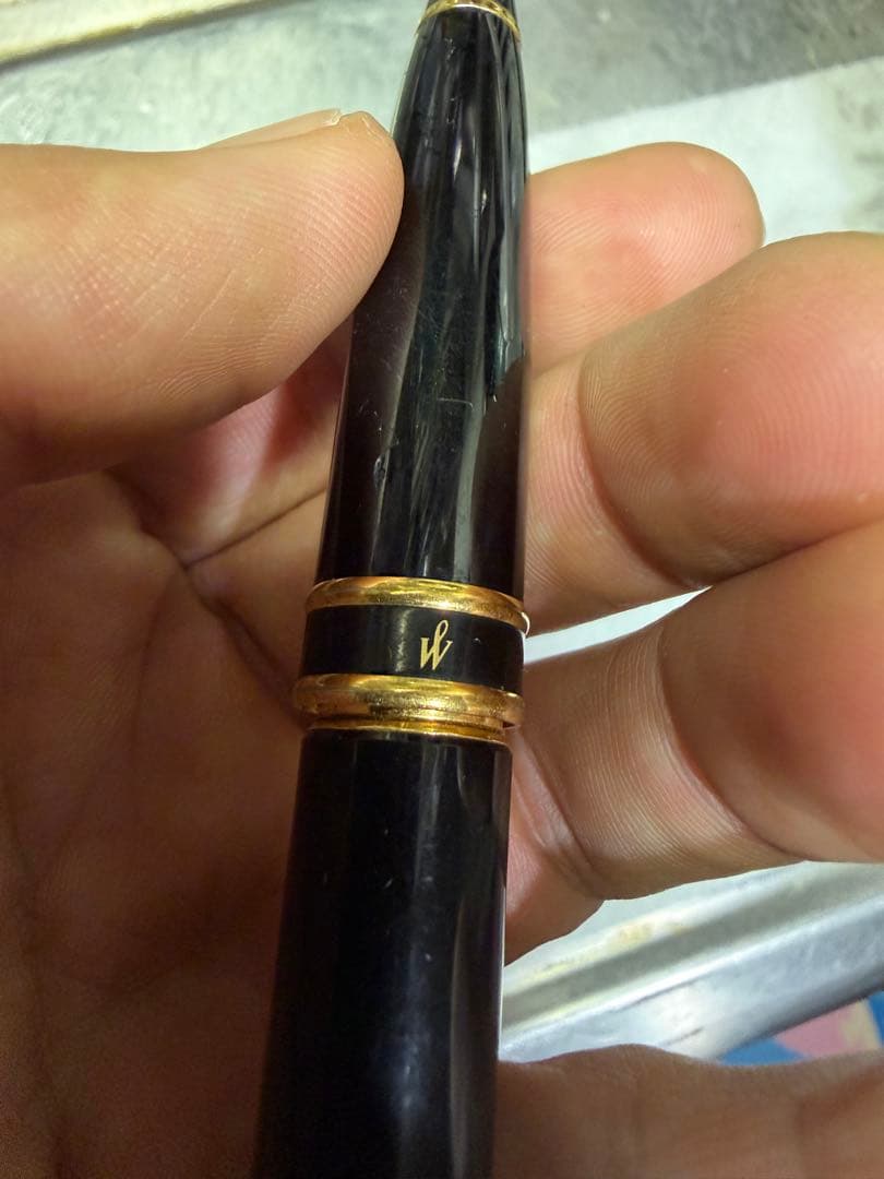 Waterman Paris black gold fountain pen with sleek design and gold accents on a white background