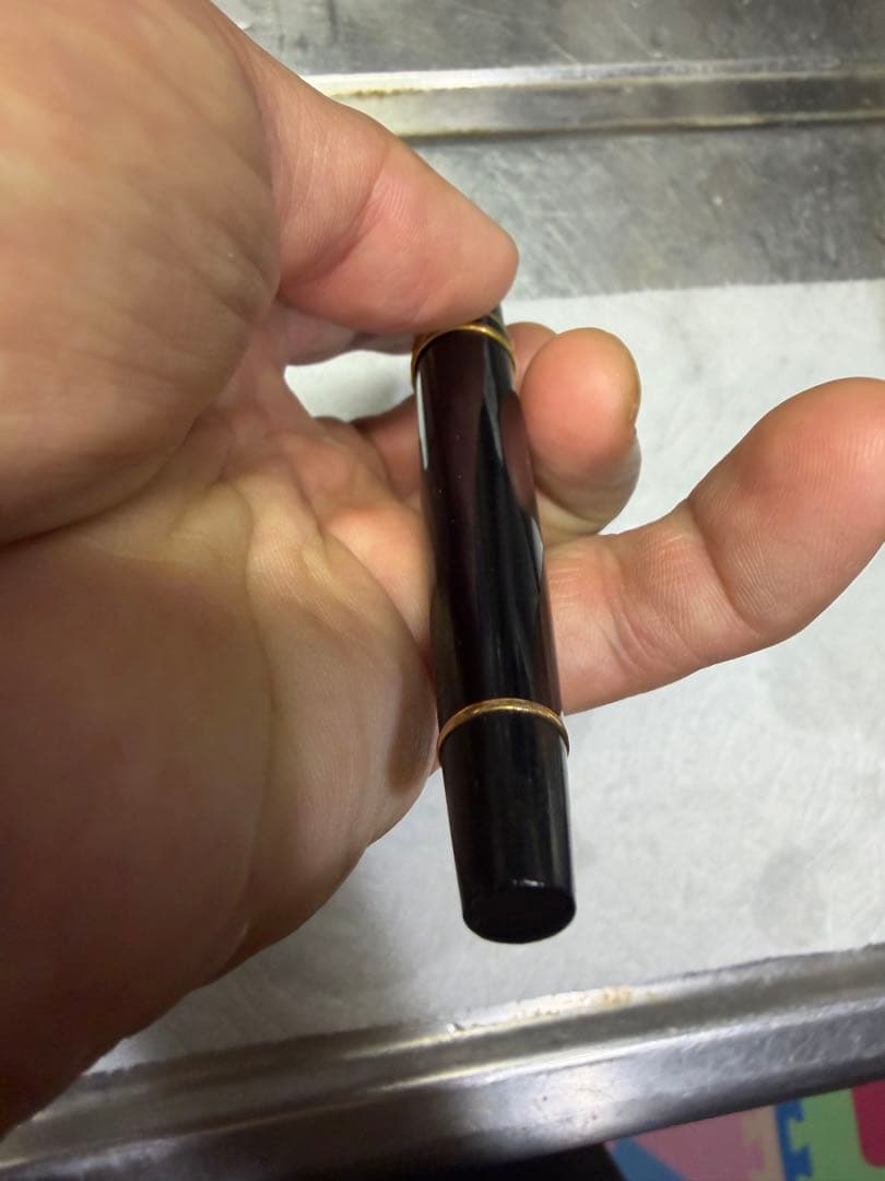 Waterman Paris black gold fountain pen with sleek design and gold accents on a white background