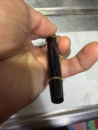 Waterman Paris black gold fountain pen with sleek design and gold accents on a white background